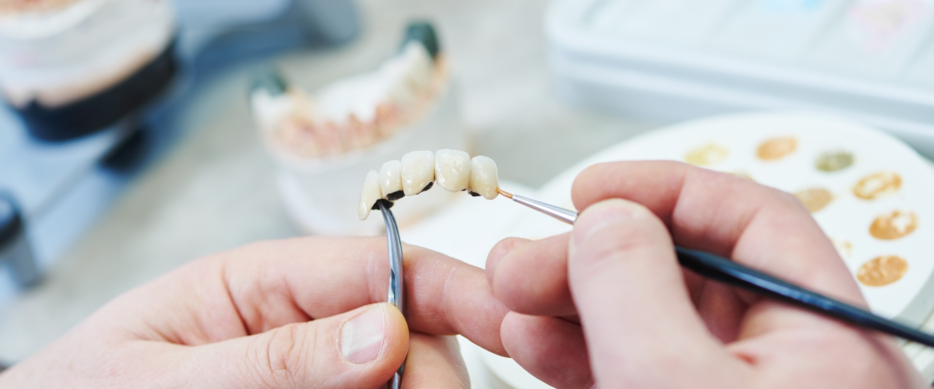 dental prosthesis work. Painting teeth